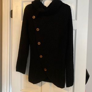 Black knit sweater with brown button detail. Size medium.